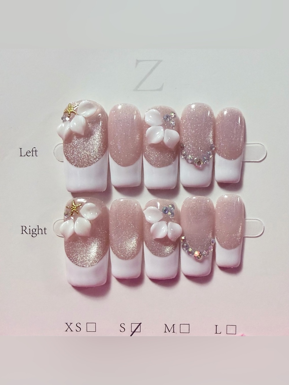 Elegant Pink Glitter French Tip Press-On Nails with Floral Accents